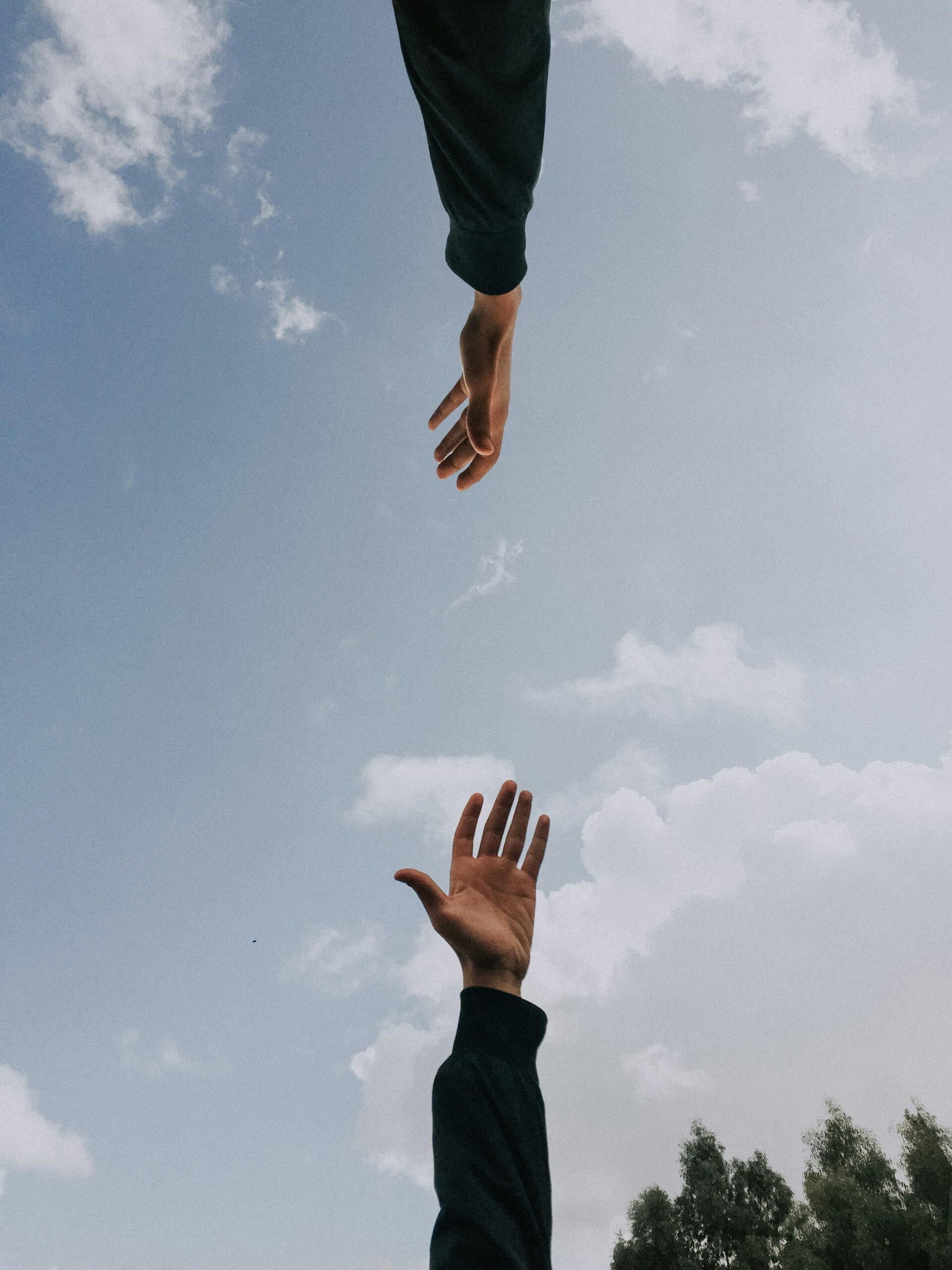 hands reaching for one anothr perfectionism people pleasing burnout therapy counseling texas florida connecticut teen girls women