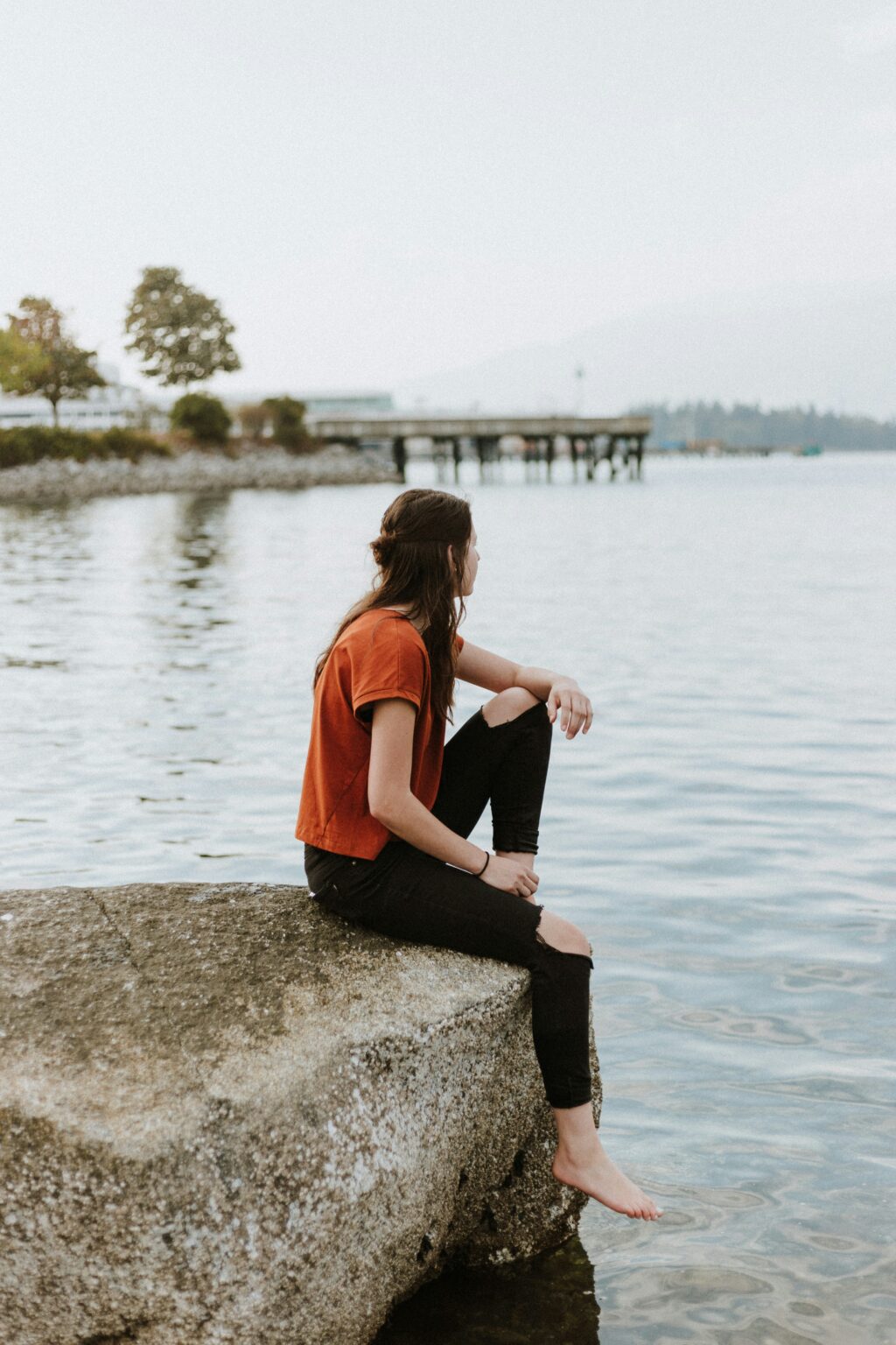 woman sitting somatic trauma perfecitonism people pleasing burnout emdr therapy counseling experiencing austin texas tampa bay florida connecticut