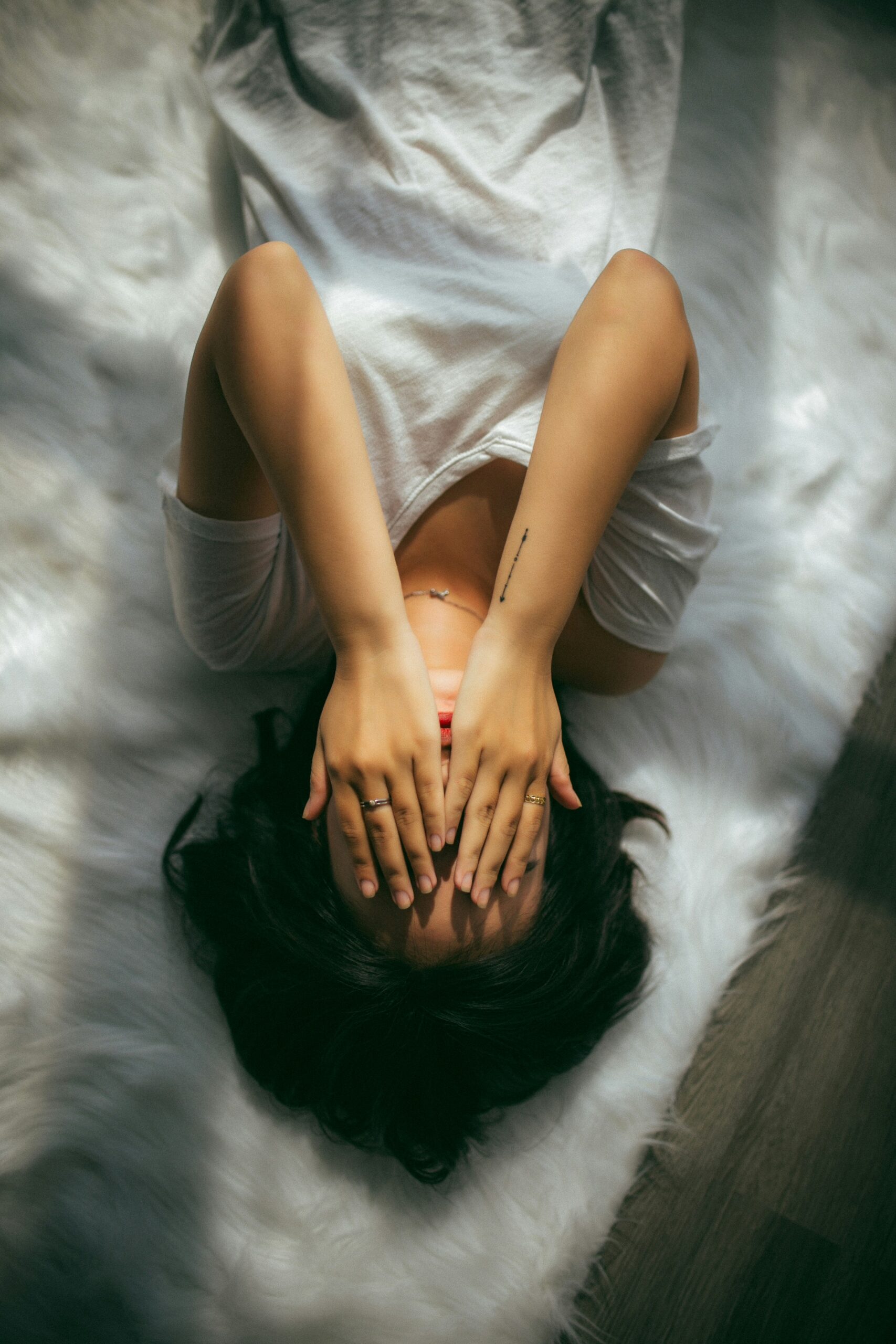girl covering face depression trauma anxiety somatic therapy counseling austin lakeway bee cave texas teen girls young adult women burnout
