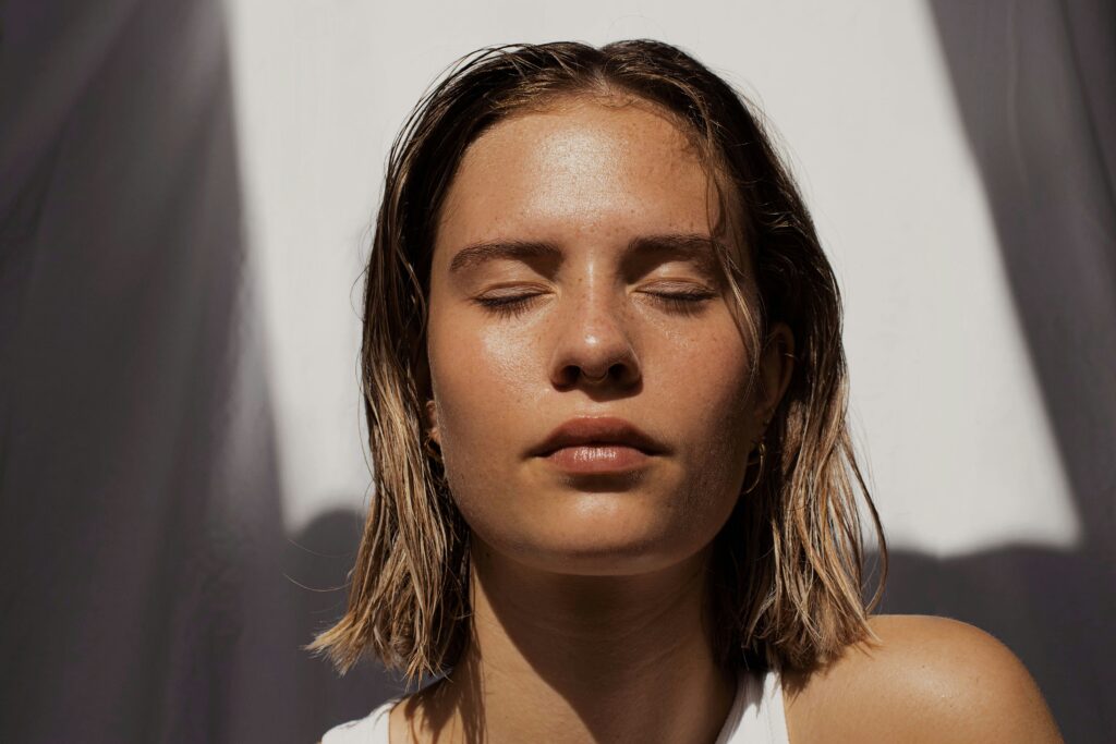 woman closing eyes therapy counseling somatic st petersburg tampa bay florida women teen girls perfectionism burnout people pleasing